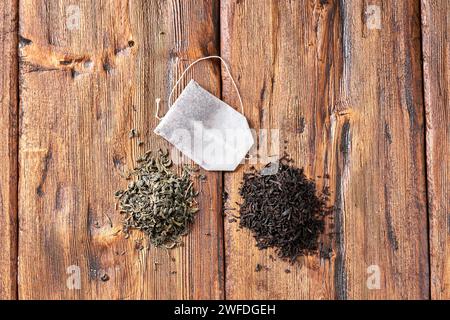 Tea bag, green and black tea on an wooden table. Stock Photo