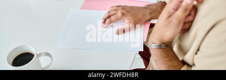 cropped view of indian blind man in everyday attire with walking stick reading braille code, banner Stock Photo