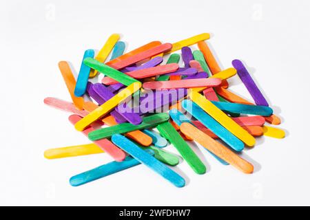 small wooden sticks for children math counting isolated on white background Stock Photo
