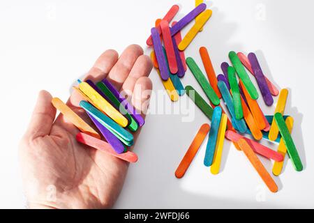 small wooden sticks for children math counting isolated on white background Stock Photo