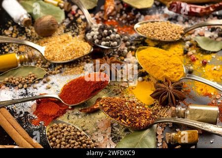 Various spices in vintage spoons Stock Photo