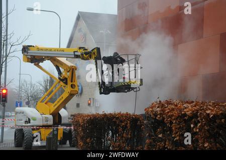 Copenhagen, Denmark /30 January 2024/.Perosn washing and clean building wall in danish capital.   (Photo.Francis Joseph Dean/Dean Pictures) Stock Photo