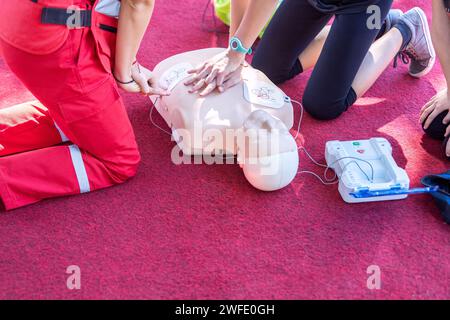 First aid and CPR training using automated external defibrillator device - AED Stock Photo