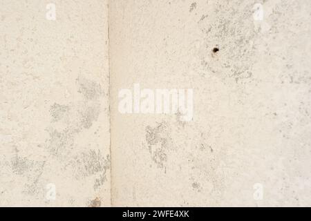 Grunge background texture of an old white plaster wall. Full frame Stock Photo