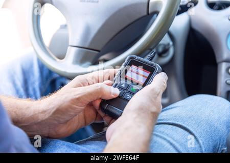 Auto mechanic using car diagnostic scan tool Stock Photo