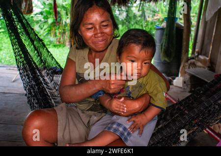 Local family in the riverside village of Timicuro I. Iqutios peruvian amazon, Loreto, Peru Stock Photo