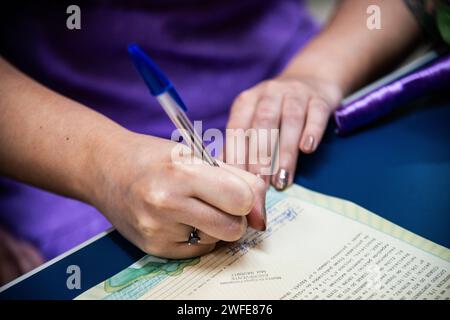 Woman brainstorming ideas on paper Stock Photo