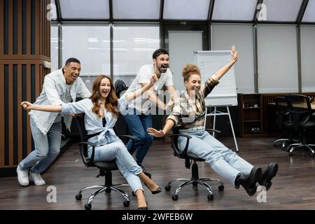 Group of diverse businesspeople working together in a modern workspace. Stock Photo
