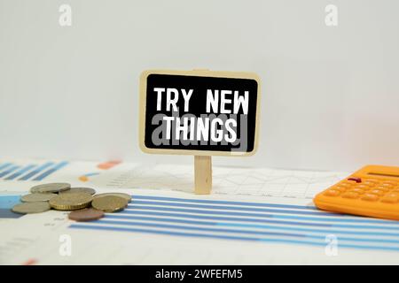 Try new Things symbol. Concept words Try new Things on wooden blocks. Beautiful pink background. Business and Try new Things concept. Copy space. Stock Photo