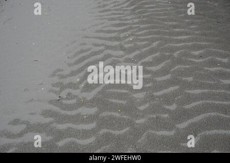 funky texture of wet and dry sand in serre ponçon, alps, france Stock Photo