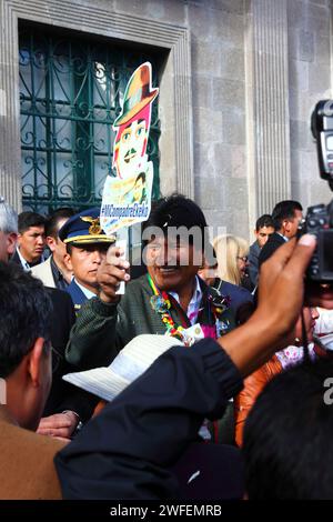 La Paz, BOLIVIA; 24th January 2015. Bolivian president Evo Morales holds a cardboard cut out figure of an Ekeko (an Aymara god of abundance) at an event to mark the start of the Alasitas festival in La Paz. Ekekos are figures believed to bring good luck and abundance in Aymara folklore, nowadays they are particularly associated with the Alasitas festival. Stock Photo