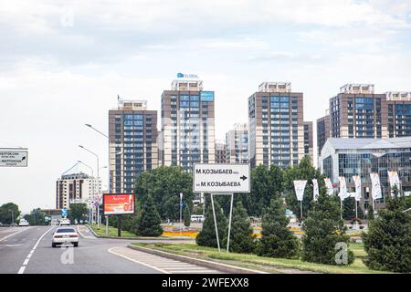 Almaty, former Kazakhstan capital, corner Al-Farabi/Kozybaev streets in the south-east of the city.Manash Kozybaev worked to help kazakhs know history Stock Photo