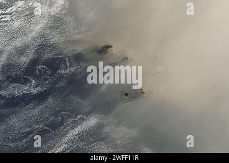 Atlantic Ocean. 25th Jan, 2024. A large plume of dust from the Sahara Desert blew west over the Atlantic Ocean and then curled north toward Europe in late January 2024. Along its path, the suspended particles brought haze and poor air quality to Cabo Verde and the Canary Islands. Some of the dust that reached the United Kingdom mixed with clouds and fell to the ground with passing rain. The image was acquired by the VIIRS (Visible Infrared Imaging Radiometer Suite) sensor on the NOAA-20 satellite. A large dust cloud expanded to the west over the ocean on January 24 and 25 before being redi Stock Photo