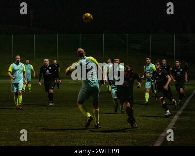 Glasgow, Scotland, UK. February 24th, 2023: Two amateur men's team playing under floodlights. Stock Photo