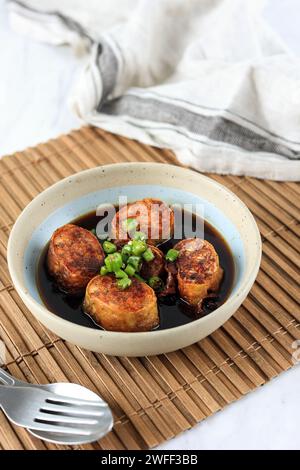 Chicken Go Hyong or Ngo Hyong, Chinese Food Made from Minced Chicken with Flour Wrap, Sliced and Deep Fried. Served with Brown Sweet and Sour Sauce Stock Photo