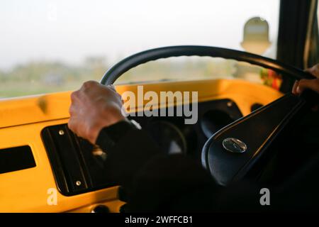 close up hand on steering Volkswagen combi car Stock Photo