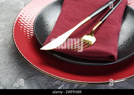 Clean plates, cutlery and napkin on table, closeup Stock Photo