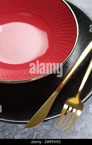 Clean plates, bowl and cutlery on table, closeup Stock Photo