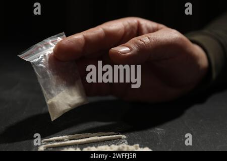 Drug addiction. Man with cocaine at grey textured table, closeup Stock ...