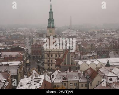 View of Poznan Poland on a snowy day, with a clock tower of City Hall in the middle of it Stock Photo