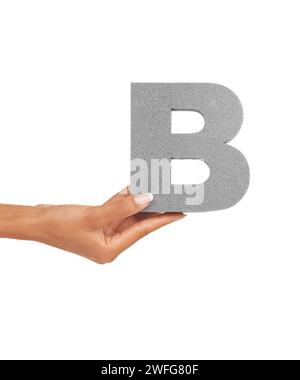 Hand of woman, capital letter B and presentation of consonant isolated on white background. Character, font and palm with English alphabet typeface Stock Photo