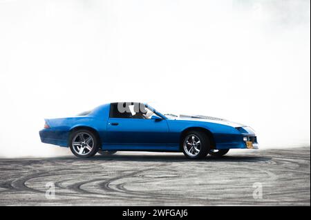 Bogota, Colombia. 27th Jan, 2024. A Chevrolet Camaro Z28 drifts during the MCM Show 2024 in Bogota, Colombia where automobile fans and collectors gather to appreciate Colombia's car culture around tuning, supercars and classics, january 27, 2024. Photo by: Chepa Beltran/Long Visual Press Credit: Long Visual Press/Alamy Live News Stock Photo