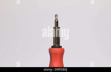 A closeup of a screwdriver's head on a white background Stock Photo