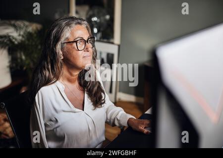 Female freelancer with disability working at home Stock Photo