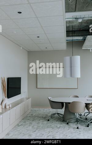 Interior of empty board room with blank whiteboard at corporate office Stock Photo