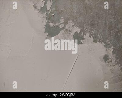 Old smeared plaster on a wall Stock Photo