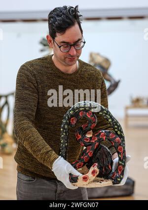 Bristol, UK. 31st Jan, 2024. A Gallery assistant with, Lamia 1994 Glazed Ceramic. A new exhibition opening at the Royal West of England Academy (RWA) in Bristol will present an extremely rare and largely unknown aspect of the late artist John Hoyland's career, ceramic sculptures.3 February - 12 May 2024.Paul Quezada-Neiman/Alamy Live News Credit: Paul Quezada-Neiman/Alamy Live News Stock Photo