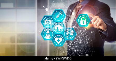Faceless businessman plugging virtual padlock into health care IT interface. Technology concept for healthcare data exchange and health information ma Stock Photo