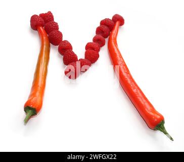 Letter M from raspberry, red orange chili peppers alphabetic ABC capital letters made of chillies, pepper, for text, encyclopedia, cook book, bar menu Stock Photo