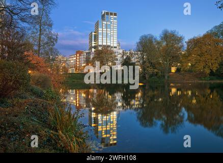 LVA main building reflected in pond Kaiserteich in the fall in the evening, Germany, North Rhine-Westphalia, Lower Rhine, Dusseldorf Stock Photo