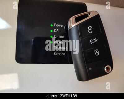 Car key and router, symbol for e-mobility Stock Photo