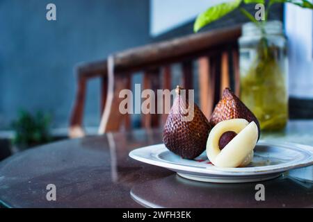 3 Snake fruits on a plate Stock Photo
