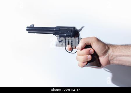 hand holding replica gun isolated on white background Stock Photo