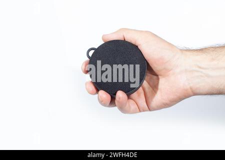 wireless speaker in hand isolated on white surface Stock Photo