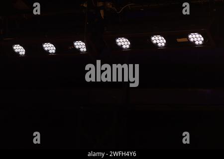 row of theater spotlights shining Stock Photo