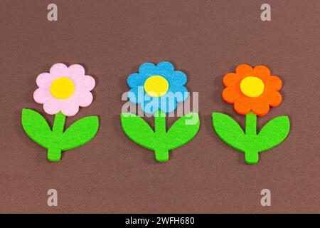 velvet flowers on brown velvet background Stock Photo