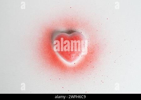 spray painted red heart on white background Stock Photo
