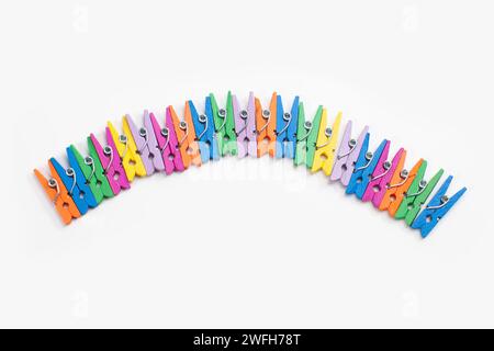 colorful clothes pegs isolated on white background Stock Photo