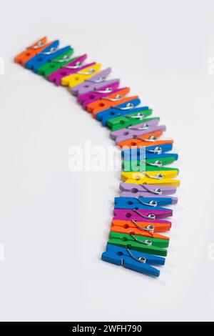 colorful clothes pegs isolated on white background Stock Photo