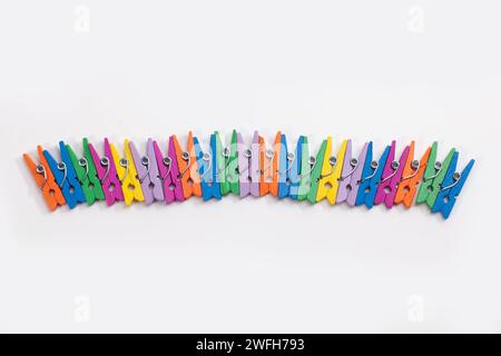colorful clothes pegs isolated on white background Stock Photo