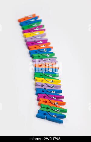 colorful clothes pegs isolated on white background Stock Photo