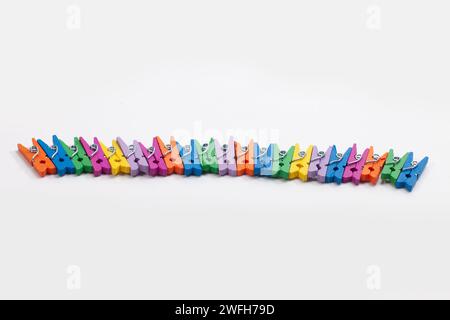 colorful clothes pegs isolated on white background Stock Photo