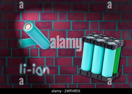 Lithium battery pack floating in the air on the background of red brick wall. Stock Photo