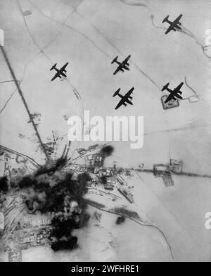 Martin B-26 Marauders dropping bombs on the marshalling yards at Enskirtchen in Bavaria, Germany in Novemmber 1944. The American twin-engined medium bombers were part of the huge raids to destroy the Grman transport network during the second World War. Stock Photo