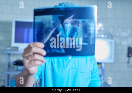 doctor holding x-ray result close up, ultrasonic ultrasound machine, selective focus Stock Photo