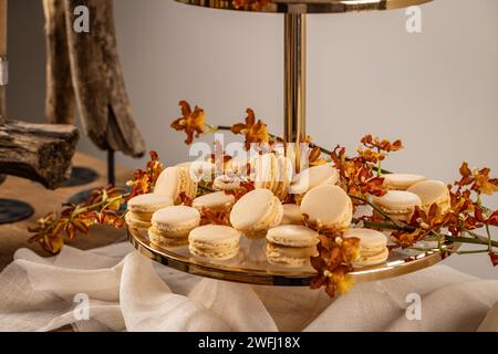 Sweet pastel colored macarons on festive table Stock Photo